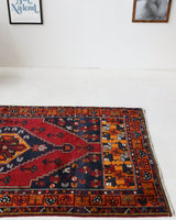 Vintage Turkish rug in a living room setting, pile rug, Turkish rug, vintage rug, portland, rug shop, bright colors, wild shaman, soft rug, bold color, Portland, Oregon, rug store, rug shop, local shop