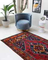 Vintage Turkish rug in a living room setting, pile rug, Turkish rug, vintage rug, portland, rug shop, bright colors, wild shaman, soft rug, bold color, Portland, Oregon, rug store, rug shop, local shop