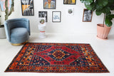 Vintage Turkish rug in a living room setting, pile rug, Turkish rug, vintage rug, portland, rug shop, bright colors, wild shaman, soft rug, bold color, Portland, Oregon, rug store, rug shop, local shop