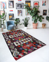 Vintage kilim rug in living room setting, bright colors, wild shaman, soft rug, bold color, Portland, Oregon, rug store, rug shop, local shop, vintage rug, modern kilim, warm colors