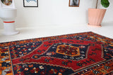 Vintage Turkish rug in a living room setting, pile rug, Turkish rug, vintage rug, portland, rug shop, bright colors, wild shaman, soft rug, bold color, Portland, Oregon, rug store, rug shop, local shop