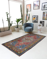 Vintage Turkish rug in living room setting, old rug, antique rug, pastel colors, faded colors, Turkish rug, vintage rug, soft rug, Portland, Oregon, rug store, rug shop, local shop