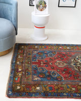 Vintage Turkish rug in living room setting, old rug, antique rug, pastel colors, faded colors, Turkish rug, vintage rug, soft rug, Portland, Oregon, rug store, rug shop, local shop