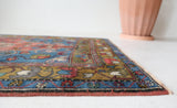 Vintage Turkish rug in living room setting, old rug, antique rug, pastel colors, faded colors, Turkish rug, vintage rug, soft rug, Portland, Oregon, rug store, rug shop, local shop