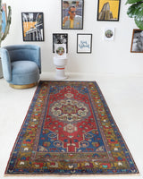 Vintage Turkish rug in a living room setting, pile rug, Turkish rug, vintage rug, portland, rug shop, bright colors, wild shaman, soft rug, bold color, Portland, Oregon, rug store, rug shop, local shop, antique rug