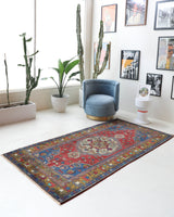 Vintage Turkish rug in a living room setting, pile rug, Turkish rug, vintage rug, portland, rug shop, bright colors, wild shaman, soft rug, bold color, Portland, Oregon, rug store, rug shop, local shop, antique rug