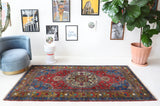 Vintage Turkish rug in a living room setting, pile rug, Turkish rug, vintage rug, portland, rug shop, bright colors, wild shaman, soft rug, bold color, Portland, Oregon, rug store, rug shop, local shop, antique rug