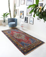 Vintage Turkish rug in a living room setting, pile rug, Turkish rug, vintage rug, portland, rug shop, bright colors, wild shaman, soft rug, bold color, Portland, Oregon, rug store, rug shop, local shop, antique rug