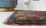 Vintage Turkish rug in a living room setting, pile rug, Turkish rug, vintage rug, portland, rug shop, bright colors, wild shaman, soft rug, bold color, Portland, Oregon, rug store, rug shop, local shop, antique rug