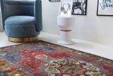 Vintage Turkish rug in a living room setting, pile rug, Turkish rug, vintage rug, portland, rug shop, bright colors, wild shaman, soft rug, bold color, Portland, Oregon, rug store, rug shop, local shop, antique rug