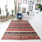 Vintage kilim rug in living room setting, old rug, antique rug, pastel colors, faded colors, Turkish rug, vintage rug, soft rug, Portland, Oregon, rug store, rug shop, local shop, earthy tones, earthy colors, warm colors