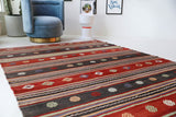 Vintage kilim rug in living room setting, old rug, antique rug, pastel colors, faded colors, Turkish rug, vintage rug, soft rug, Portland, Oregon, rug store, rug shop, local shop, earthy tones, earthy colors, warm colors