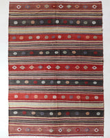 Vintage kilim rug in living room setting, old rug, antique rug, pastel colors, faded colors, Turkish rug, vintage rug, soft rug, Portland, Oregon, rug store, rug shop, local shop, earthy tones, earthy colors, warm colors