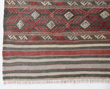 Vintage kilim rug in room decor setting, old rug, antique rug, pastel colors, faded colors, Turkish rug, vintage rug, soft rug, Portland, Oregon, rug store, rug shop, local shop, bold colors, bright colors, faded colors