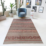 Vintage kilim rug in room decor setting, old rug, antique rug, pastel colors, faded colors, Turkish rug, vintage rug, soft rug, Portland, Oregon, rug store, rug shop, local shop, bold colors, bright colors, faded colors