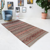 Vintage kilim rug in room decor setting, old rug, antique rug, pastel colors, faded colors, Turkish rug, vintage rug, soft rug, Portland, Oregon, rug store, rug shop, local shop, bold colors, bright colors, faded colors