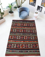 Vintage kilim rug in living room setting, bright colors, wild shaman, soft rug, bold color, Portland, Oregon, rug store, rug shop, local shop, vintage rug, modern kilim, warm colors