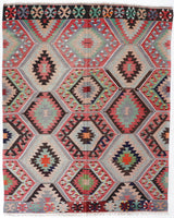 Vintage kilim rug in room decor setting, old rug, antique rug, pastel colors, faded colors, Turkish rug, vintage rug, soft rug, Portland, Oregon, rug store, rug shop, local shop, bold colors, bright colors, faded colors