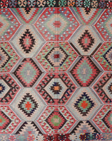 Vintage kilim rug in room decor setting, old rug, antique rug, pastel colors, faded colors, Turkish rug, vintage rug, soft rug, Portland, Oregon, rug store, rug shop, local shop, bold colors, bright colors, faded colors