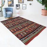 Vintage kilim rug in living room setting, bright colors, wild shaman, soft rug, bold color, Portland, Oregon, rug store, rug shop, local shop, vintage rug, modern kilim, warm colors