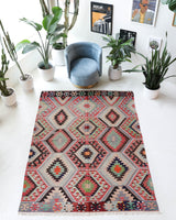Vintage kilim rug in room decor setting, old rug, antique rug, pastel colors, faded colors, Turkish rug, vintage rug, soft rug, Portland, Oregon, rug store, rug shop, local shop, bold colors, bright colors, faded colors