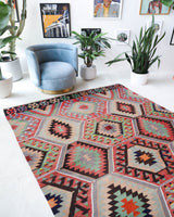 Vintage kilim rug in room decor setting, old rug, antique rug, pastel colors, faded colors, Turkish rug, vintage rug, soft rug, Portland, Oregon, rug store, rug shop, local shop, bold colors, bright colors, faded colors
