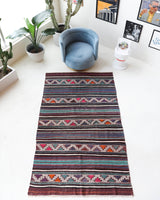 Vintage kilim rug in living room setting, bright colors, wild shaman, soft rug, bold color, Portland, Oregon, rug store, rug shop, local shop, vintage rug, modern kilim, warm colors