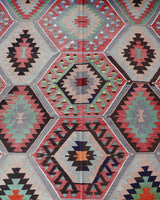 Vintage kilim rug in room decor setting, old rug, antique rug, pastel colors, faded colors, Turkish rug, vintage rug, soft rug, Portland, Oregon, rug store, rug shop, local shop, bold colors, bright colors, faded colors