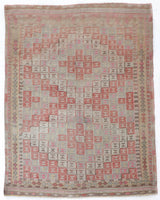 Vintage kilim rug in living room setting, old rug, antique rug, pastel colors, faded colors, Turkish rug, vintage rug, soft rug, Portland, Oregon, rug store, rug shop, local shop, earthy tones, earthy colors, warm colors