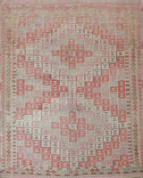 Vintage kilim rug in living room setting, old rug, antique rug, pastel colors, faded colors, Turkish rug, vintage rug, soft rug, Portland, Oregon, rug store, rug shop, local shop, earthy tones, earthy colors, warm colors