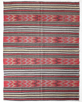 Vintage kilim rug in living room setting, old rug, antique rug, pastel colors, faded colors, Turkish rug, vintage rug, soft rug, Portland, Oregon, rug store, rug shop, local shop, earthy tones, earthy colors, warm colors