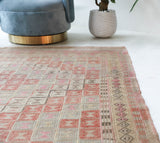 Vintage kilim rug in living room setting, old rug, antique rug, pastel colors, faded colors, Turkish rug, vintage rug, soft rug, Portland, Oregon, rug store, rug shop, local shop, earthy tones, earthy colors, warm colors
