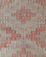 Vintage kilim rug in living room setting, old rug, antique rug, pastel colors, faded colors, Turkish rug, vintage rug, soft rug, Portland, Oregon, rug store, rug shop, local shop, earthy tones, earthy colors, warm colors