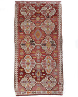 Vintage kilim rug in living room setting, old rug, antique rug, pastel colors, faded colors, Turkish rug, vintage rug, soft rug, Portland, Oregon, rug store, rug shop, local shop, earthy tones, earthy colors, warm colors