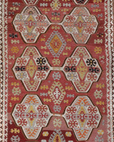 Vintage kilim rug in living room setting, old rug, antique rug, pastel colors, faded colors, Turkish rug, vintage rug, soft rug, Portland, Oregon, rug store, rug shop, local shop, earthy tones, earthy colors, warm colors