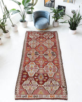 Vintage kilim rug in living room setting, old rug, antique rug, pastel colors, faded colors, Turkish rug, vintage rug, soft rug, Portland, Oregon, rug store, rug shop, local shop, earthy tones, earthy colors, warm colors