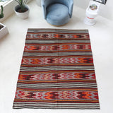 Vintage kilim rug in living room setting, bright colors, wild shaman, soft rug, bold color, Portland, Oregon, rug store, rug shop, local shop, vintage rug, modern kilim, warm colors