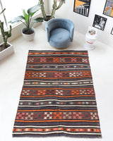 Vintage kilim rug in room decor setting, old rug, antique rug, pastel colors, faded colors, Turkish rug, vintage rug, soft rug, Portland, Oregon, rug store, rug shop, local shop, bold colors, bright colors, faded colors