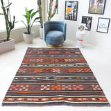 Vintage kilim rug in room decor setting, old rug, antique rug, pastel colors, faded colors, Turkish rug, vintage rug, soft rug, Portland, Oregon, rug store, rug shop, local shop, bold colors, bright colors, faded colors