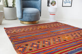 Vintage kilim rug in living room setting, bright colors, wild shaman, soft rug, bold color, Portland, Oregon, rug store, rug shop, local shop, vintage rug, modern kilim, warm colors