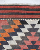 Vintage kilim rug in room decor setting, old rug, antique rug, pastel colors, faded colors, Turkish rug, vintage rug, soft rug, Portland, Oregon, rug store, rug shop, local shop, bold colors, bright colors, faded colors