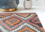 Vintage kilim rug in room decor setting, old rug, antique rug, pastel colors, faded colors, Turkish rug, vintage rug, soft rug, Portland, Oregon, rug store, rug shop, local shop, bold colors, bright colors, faded colors