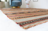 Vintage kilim rug in living room setting, old rug, antique rug, pastel colors, faded colors, Turkish rug, vintage rug, soft rug, Portland, Oregon, rug store, rug shop, local shop, earthy tones, earthy colors, warm colors