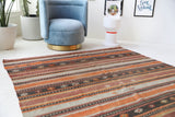 Vintage kilim rug in living room setting, old rug, antique rug, pastel colors, faded colors, Turkish rug, vintage rug, soft rug, Portland, Oregon, rug store, rug shop, local shop, earthy tones, earthy colors, warm colors