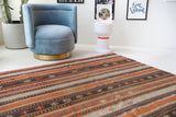 Vintage kilim rug in living room setting, old rug, antique rug, pastel colors, faded colors, Turkish rug, vintage rug, soft rug, Portland, Oregon, rug store, rug shop, local shop, earthy tones, earthy colors, warm colors