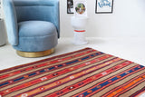 Vintage kilim rug in living room setting, bright colors, wild shaman, soft rug, bold color, Portland, Oregon, rug store, rug shop, local shop, vintage rug, modern kilim, warm colors