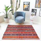 Vintage kilim rug in living room setting, bright colors, wild shaman, soft rug, bold color, Portland, Oregon, rug store, rug shop, local shop, vintage rug, modern kilim, warm colors
