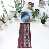 Vintage Turkish runner rug in a living room setting, pile rug, Turkish rug, vintage rug, portland, rug shop, bright colors, wild shaman, soft rug, bold color, Portland, Oregon, rug store, rug shop, local shop, antique rug