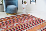Vintage kilim rug in room decor setting, old rug, antique rug, pastel colors, faded colors, Turkish rug, vintage rug, soft rug, Portland, Oregon, rug store, rug shop, local shop, bold colors, bright colors, faded colors