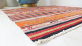 Vintage kilim rug in room decor setting, old rug, antique rug, pastel colors, faded colors, Turkish rug, vintage rug, soft rug, Portland, Oregon, rug store, rug shop, local shop, bold colors, bright colors, faded colors